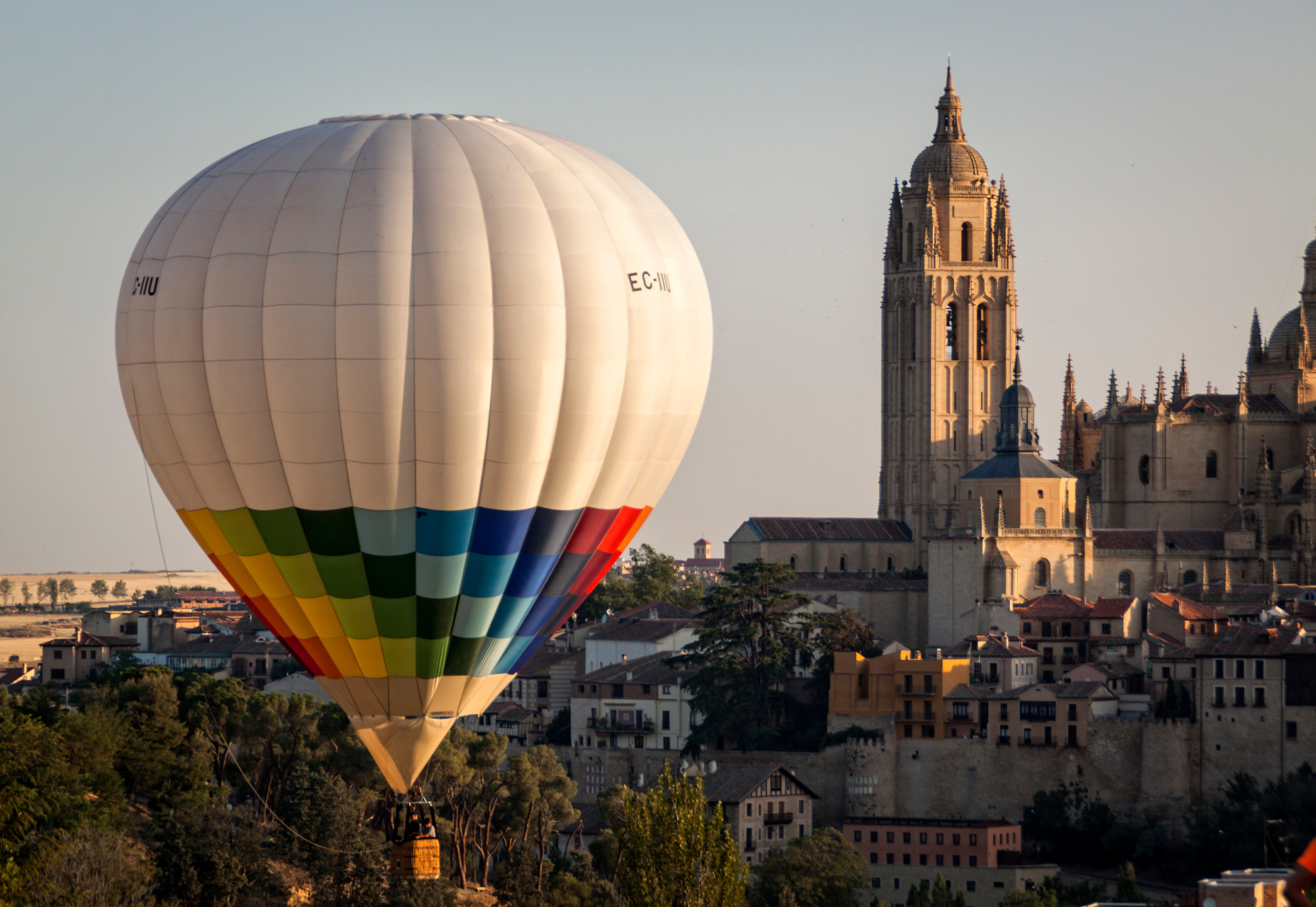 Hot air balloon flying over Segovia