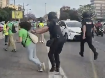 Police Officer Knocks Down Retired Teacher at Valencia Protest — Footage Sparks Outrage