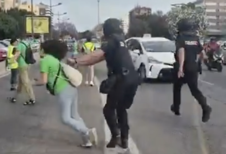 Police Officer Knocks Down Retired Teacher at Valencia Protest — Footage Sparks Outrage