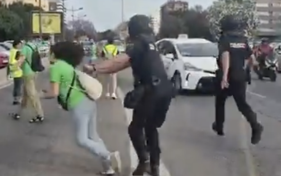 Police Officer Knocks Down Retired Teacher at Valencia Protest — Footage Sparks Outrage